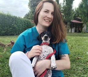 Dr Lucic holding dog